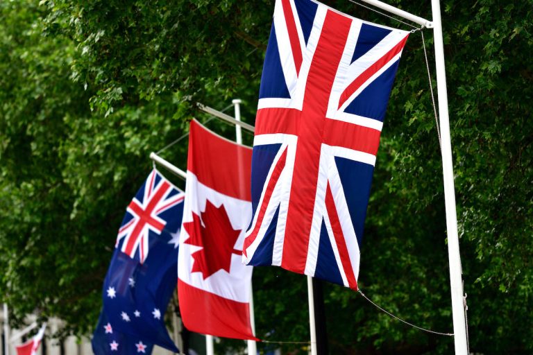 London, England, UK. Commonwealth flags in Horse Guards Road ready for the Trooping of the Colour. Australia; Canada; Union flag